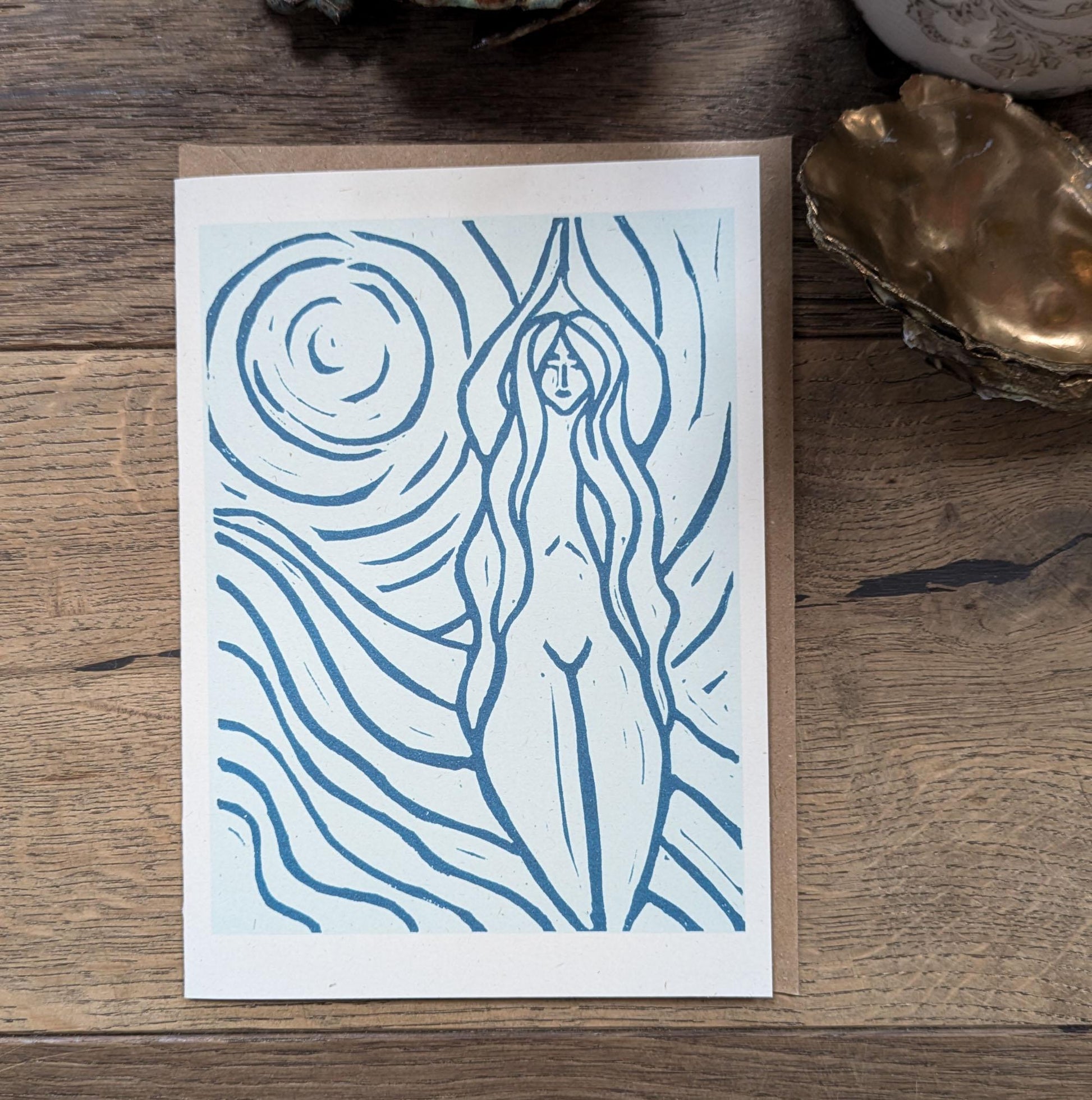 blue greeting card with naked woman the moon and water around her achelois