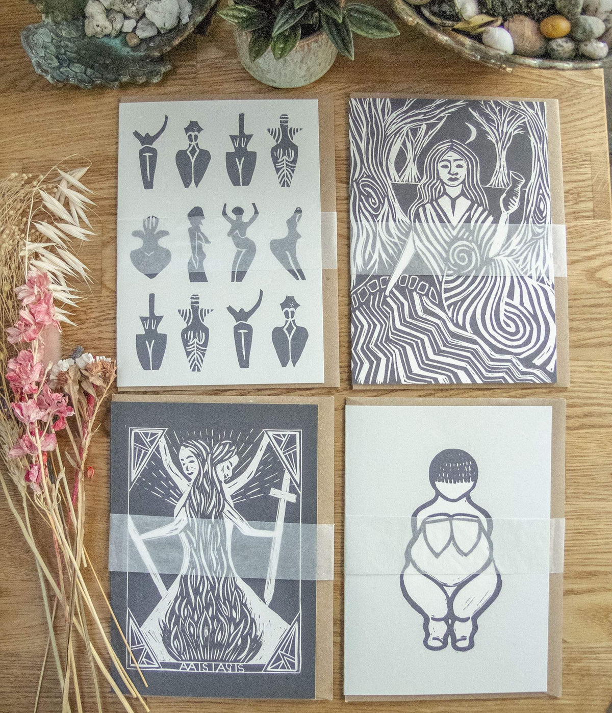 Goddess Greeting Cards in a set of four, featuring monochrome hand-printed figures and abstract designs on cream and dark paper