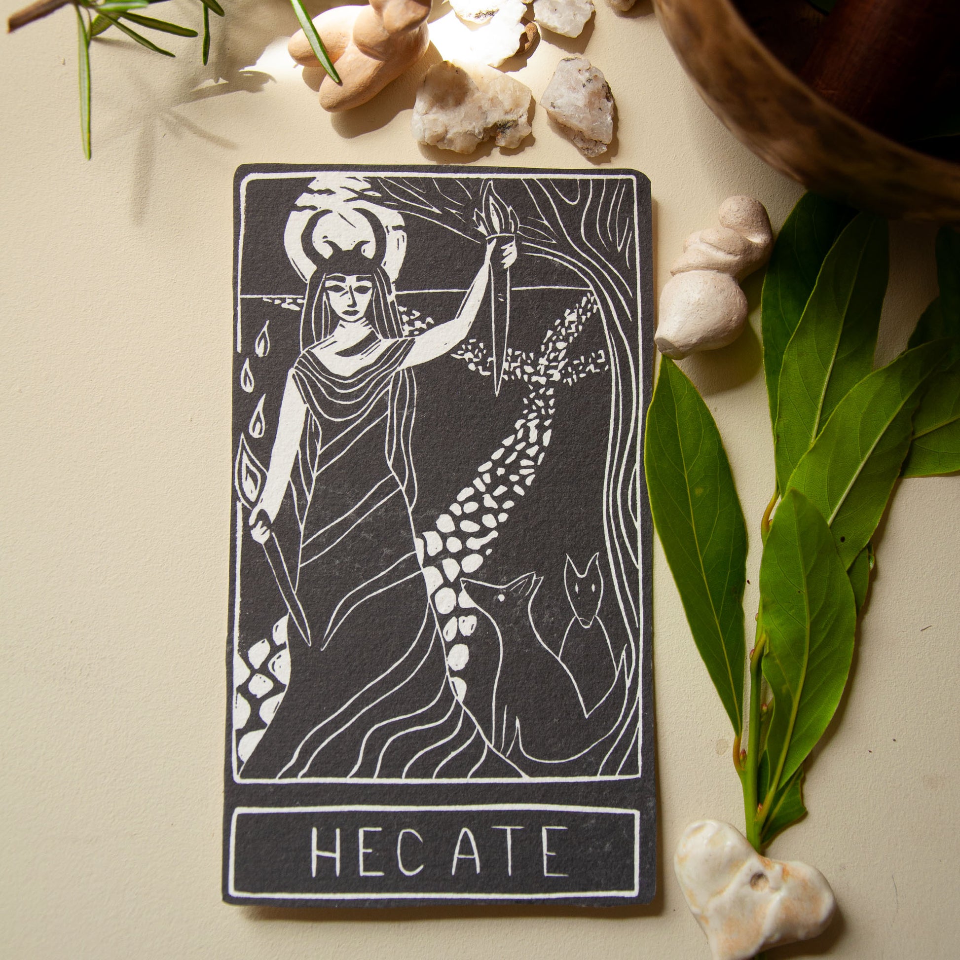 Hecate tarot card with nature elements on a neutral background