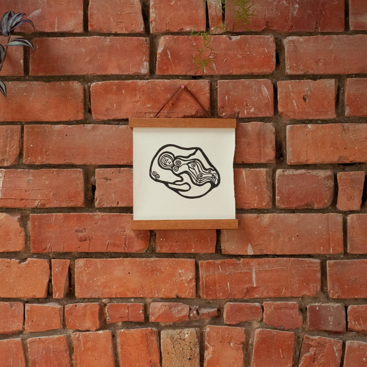 NORTHUMBERLANDIA | Original linocut print hanging on a brick wall
