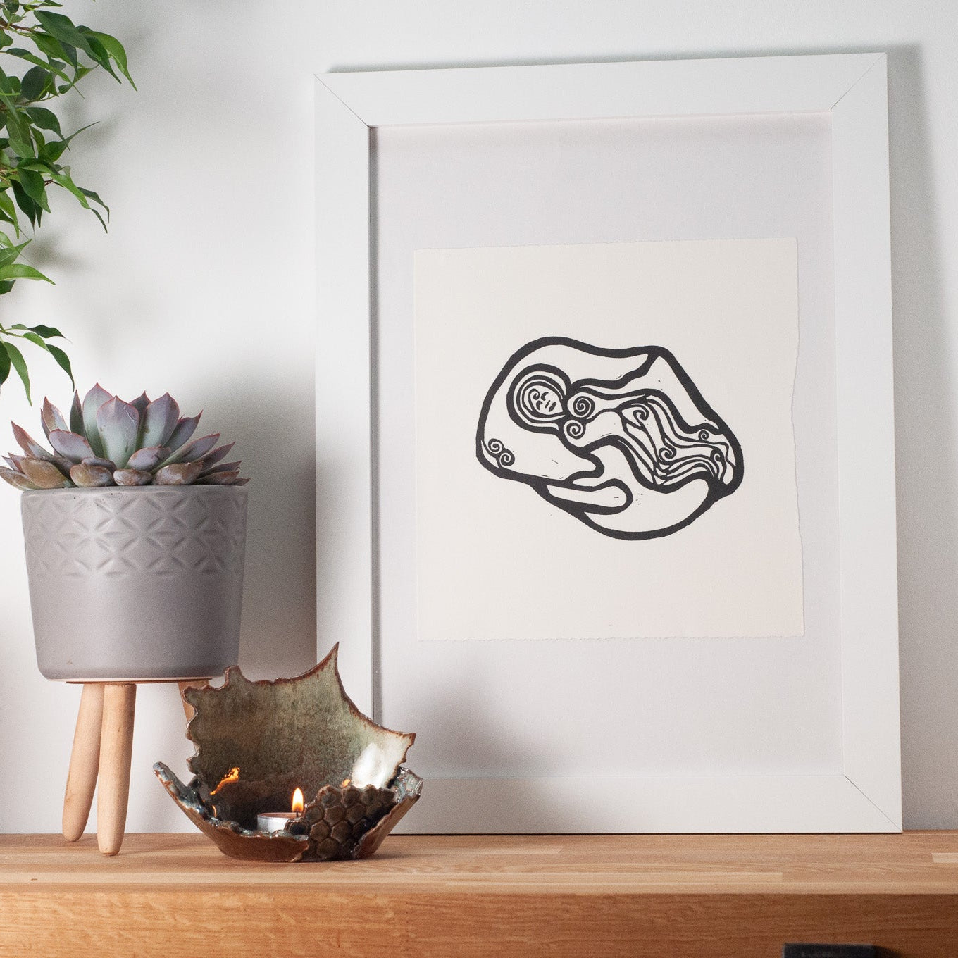 NORTHUMBERLANDIA | Original linocut print white frame on wood shelf. bright and airy