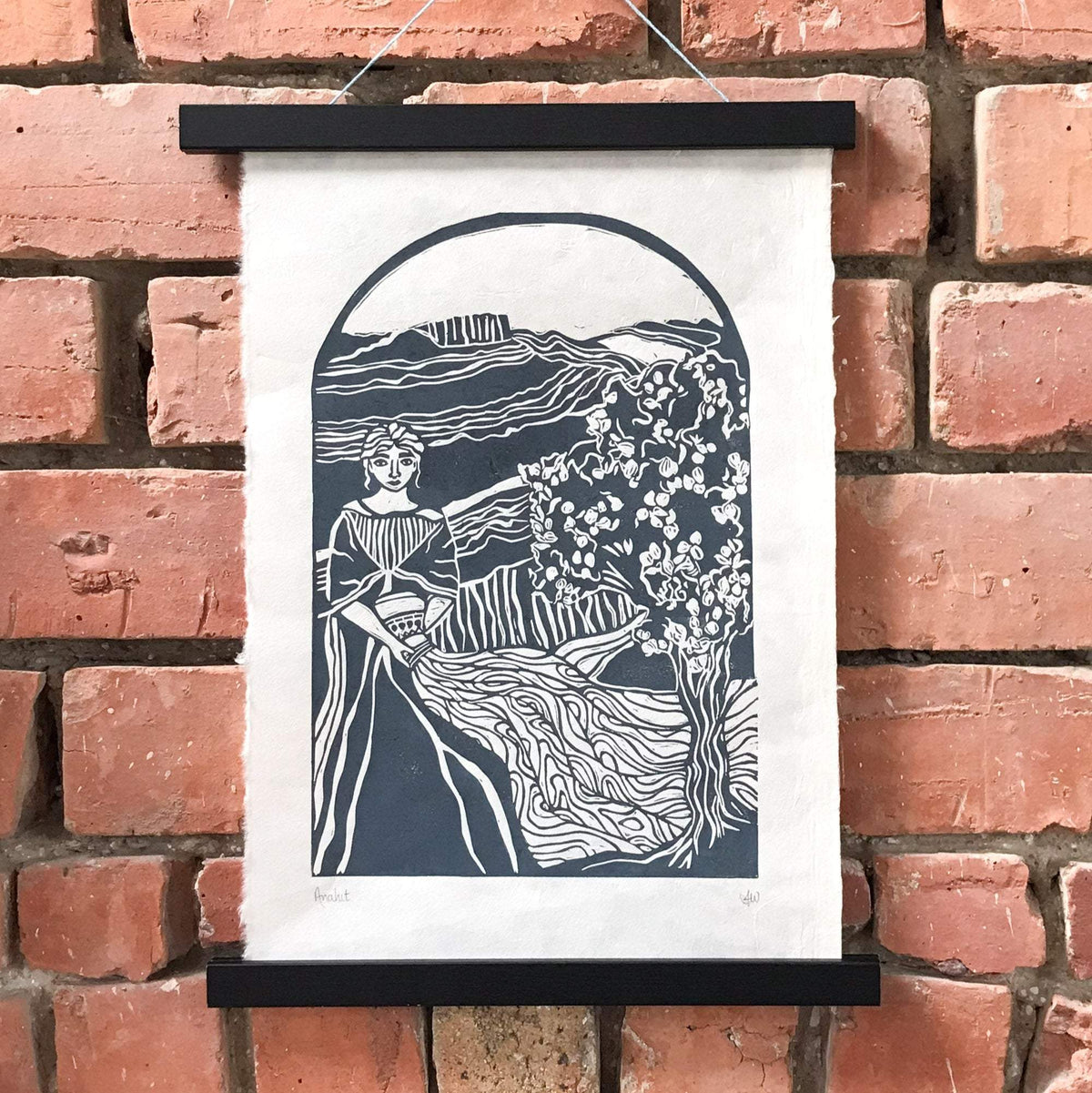 ANAHIT | ARMENIAN GODDESS linocut print in deep blue-grey, depicting a seated figure beside a flowering tree