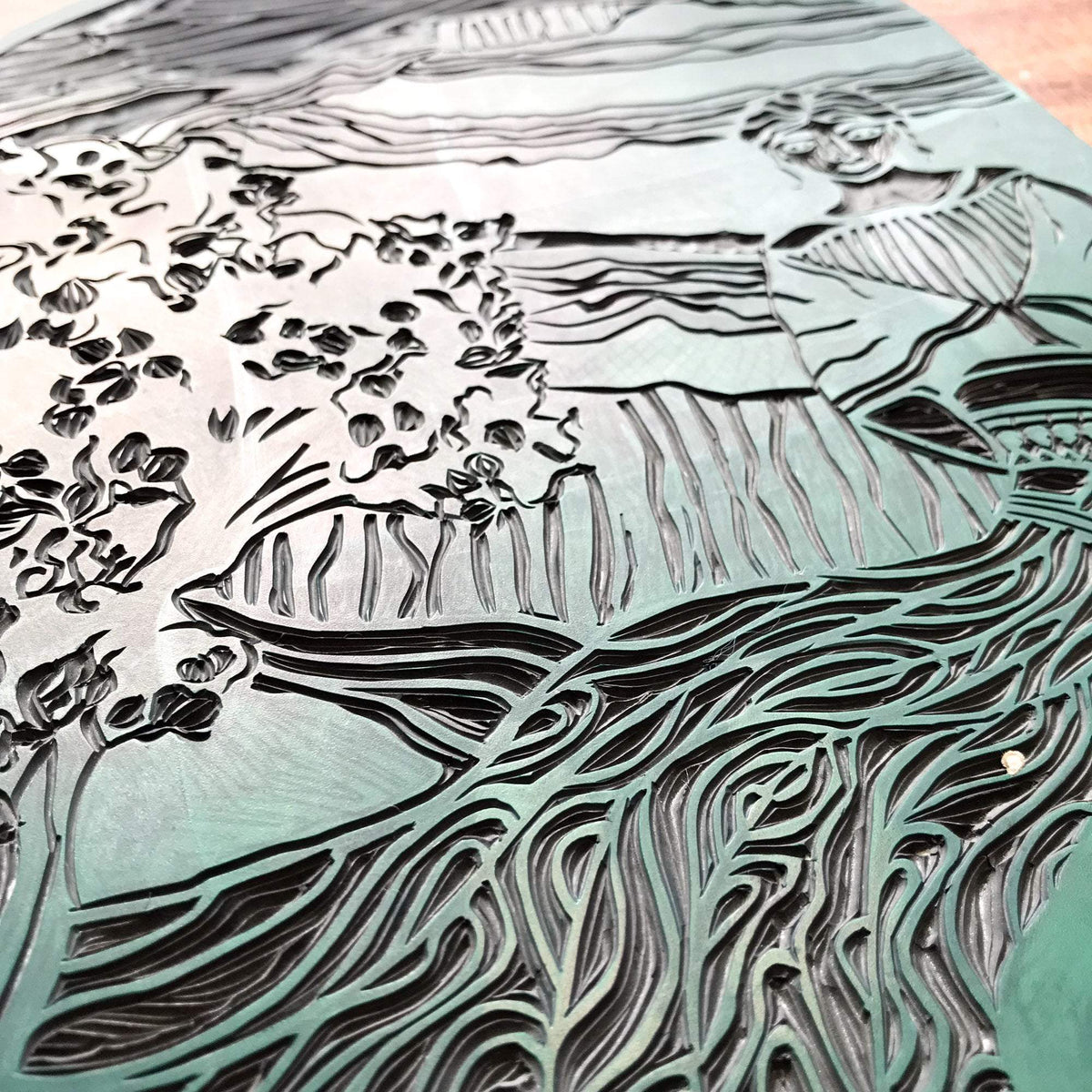 ANAHIT | ARMENIAN GODDESS linocut print in deep blue-grey, with a flowing female figure, foliage and wave-like lines