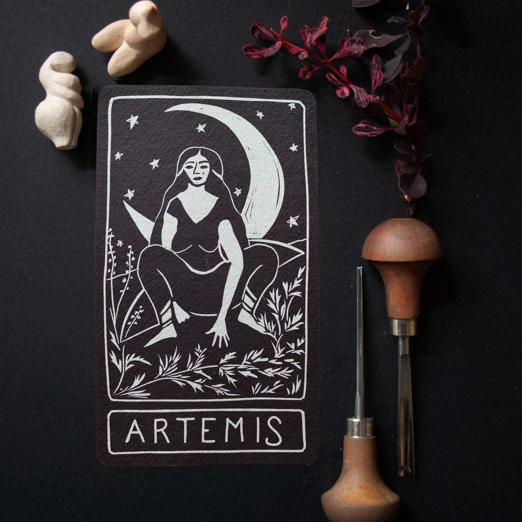 ARTEMIS ALTAR CARD in black cotton rag, featuring a white linocut-style goddess beneath a crescent moon and stars