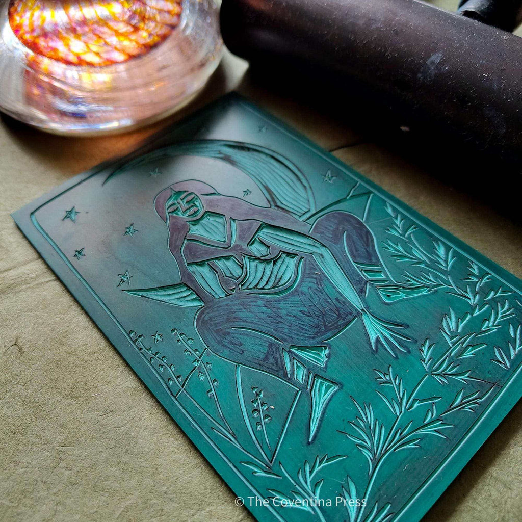 ARTEMIS ALTAR CARD featuring a teal linocut-style illustration of a seated goddess with a bow, stars and foliage