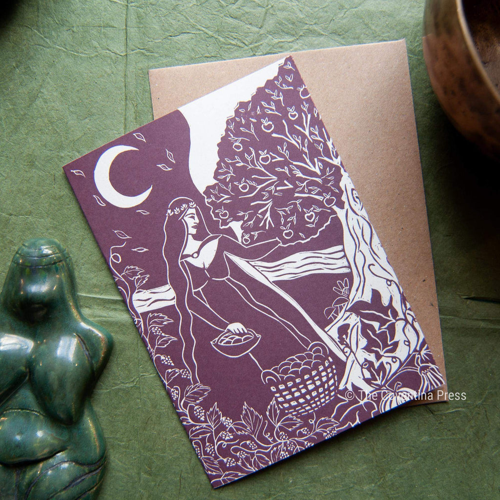 AUTUMN EQUINOX GREETING CARD in plum and cream, featuring a linocut-style woman beneath a tree and crescent moon