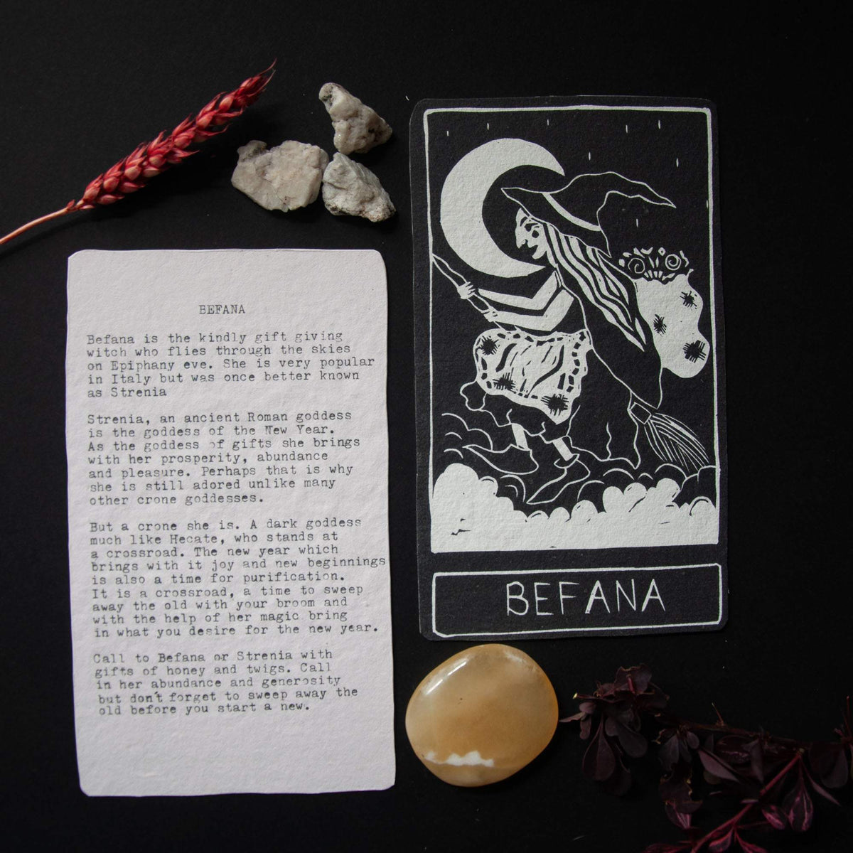 BEFANA ORACLE CARD featuring a black and cream linocut witch design, with a printed mythology and guidance text on the reverse.