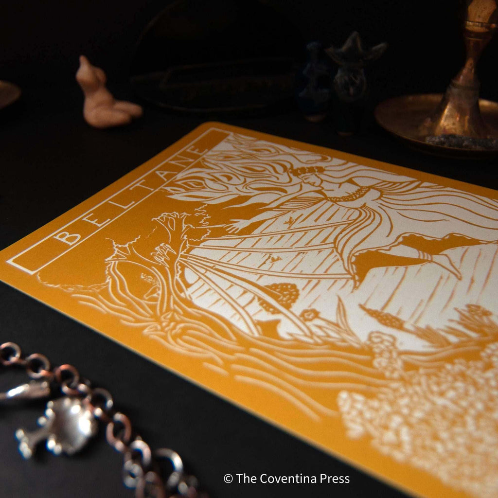 BELTANE | Altar card with an ochre ground and white linocut-style May Queen illustration and lettering