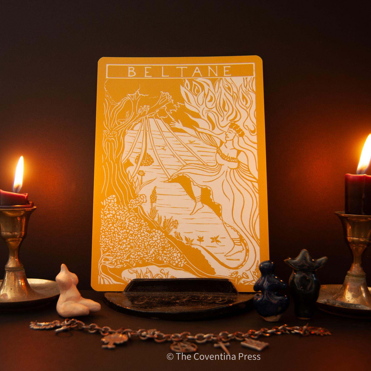BELTANE | Altar card in orange cardstock, featuring a cream linocut-style May Queen among flowing foliage