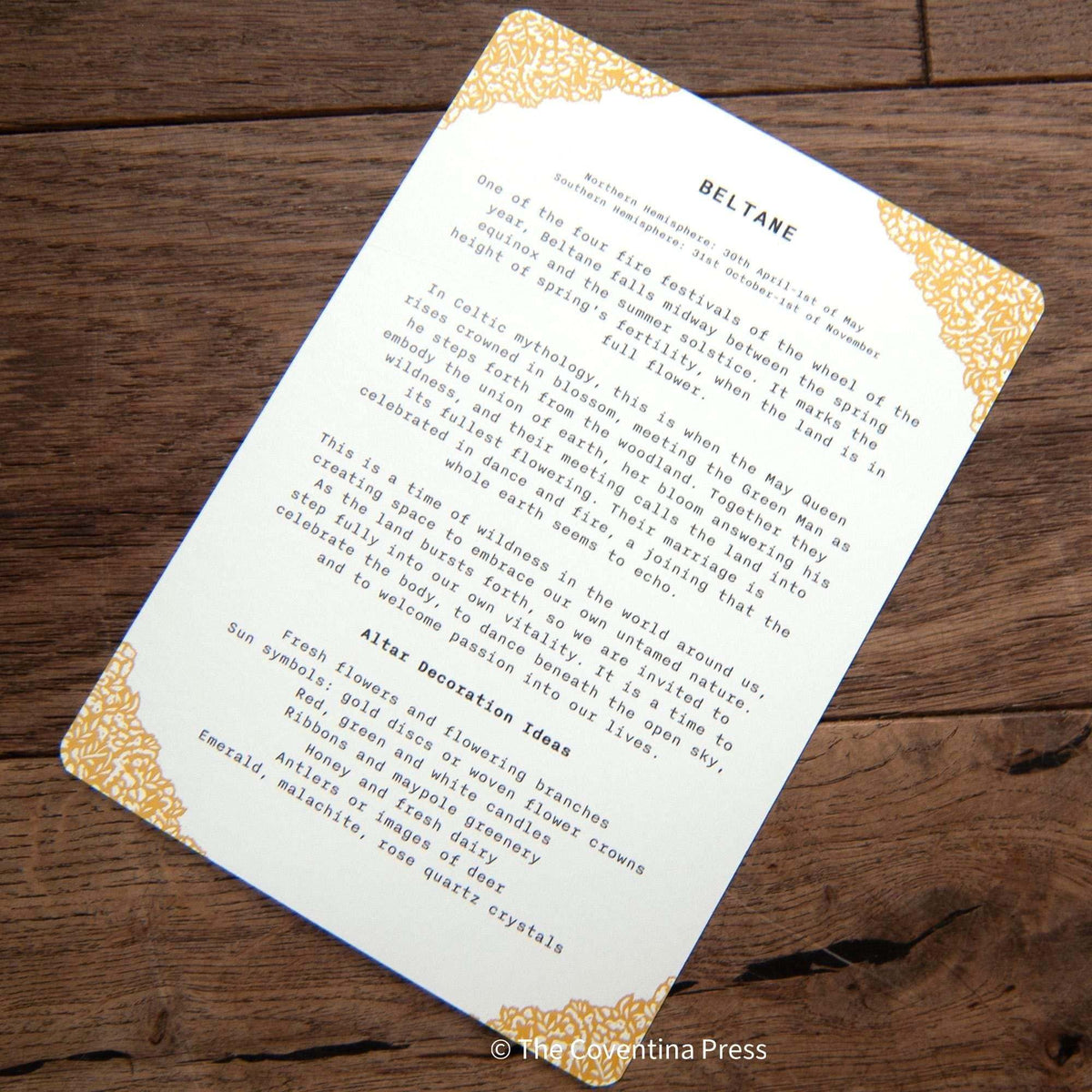 BELTANE | Altar card printed on white cardstock, with small black text and ornate golden corner flourishes