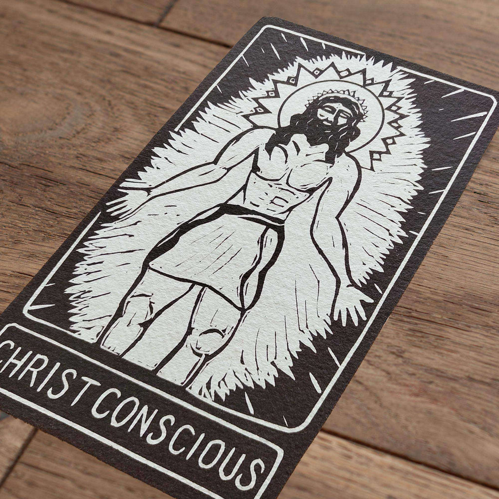 CHRIST CONSCIOUS ALTAR CARD in black and cream with a linocut-style reclining Christ figure surrounded by radiant rays