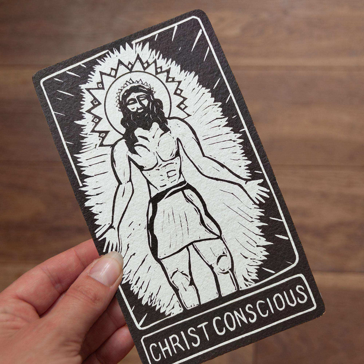 CHRIST CONSCIOUS ALTAR CARD with a black-and-white linocut-style figure of Christ, radiant halo and bold lettering