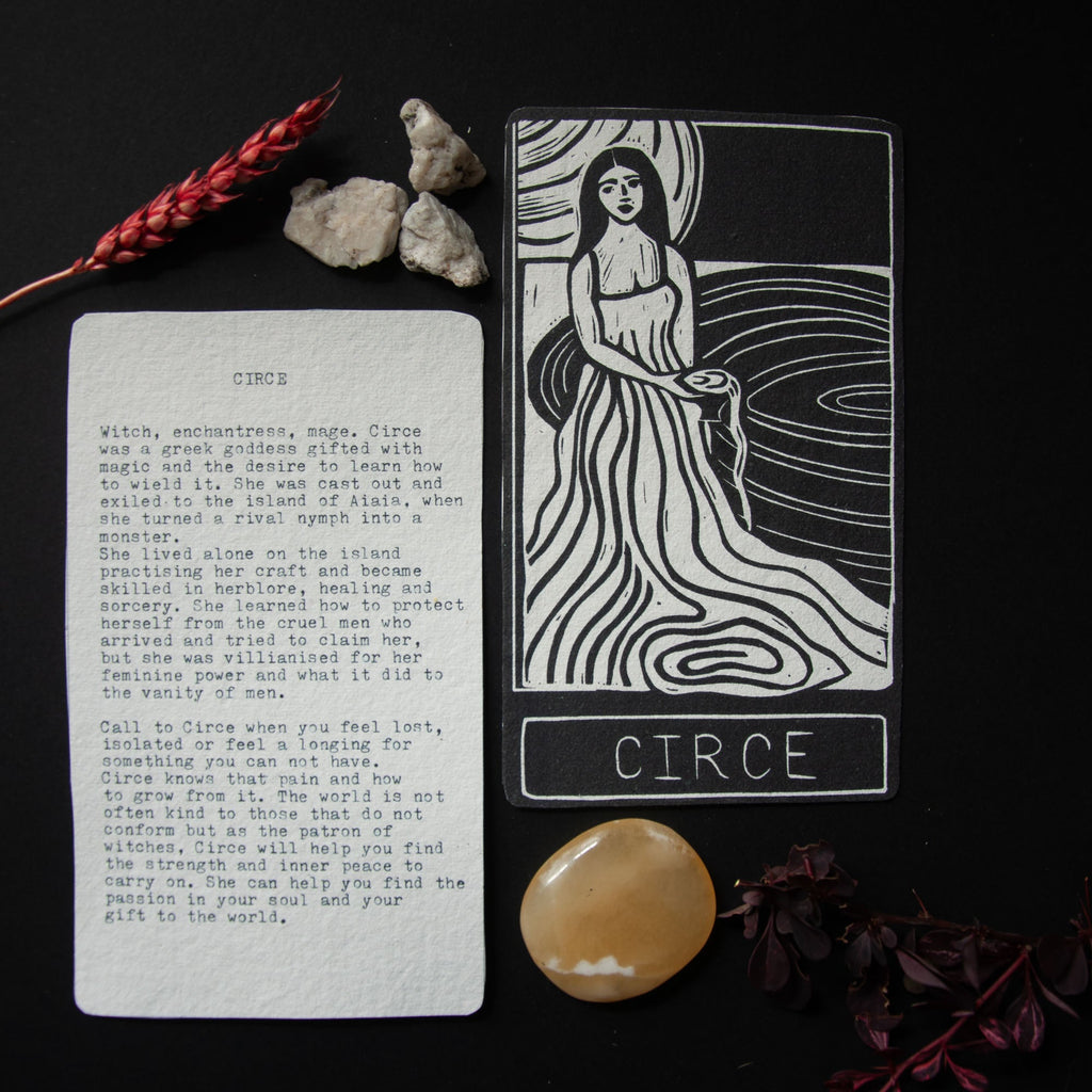 CIRCE ORACLE CARD linocut depicting a robed woman by swirling water, with a printed goddess guidance card
