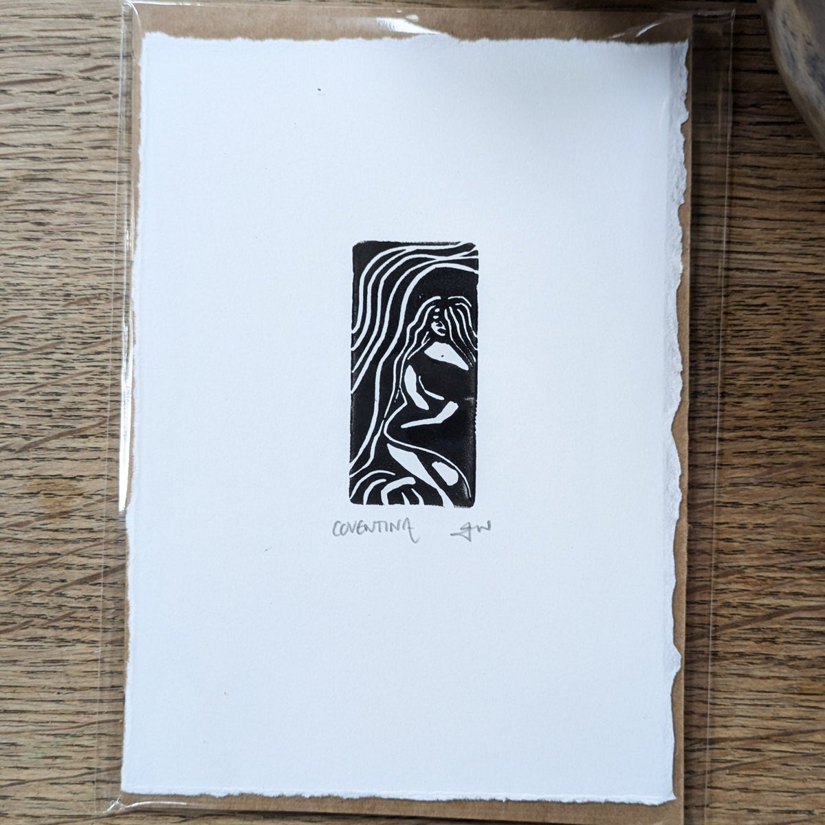 COVENTINA BRITISH WATER GODDESS miniature print in black, featuring a flowing-haired figure framed by swirling water lines