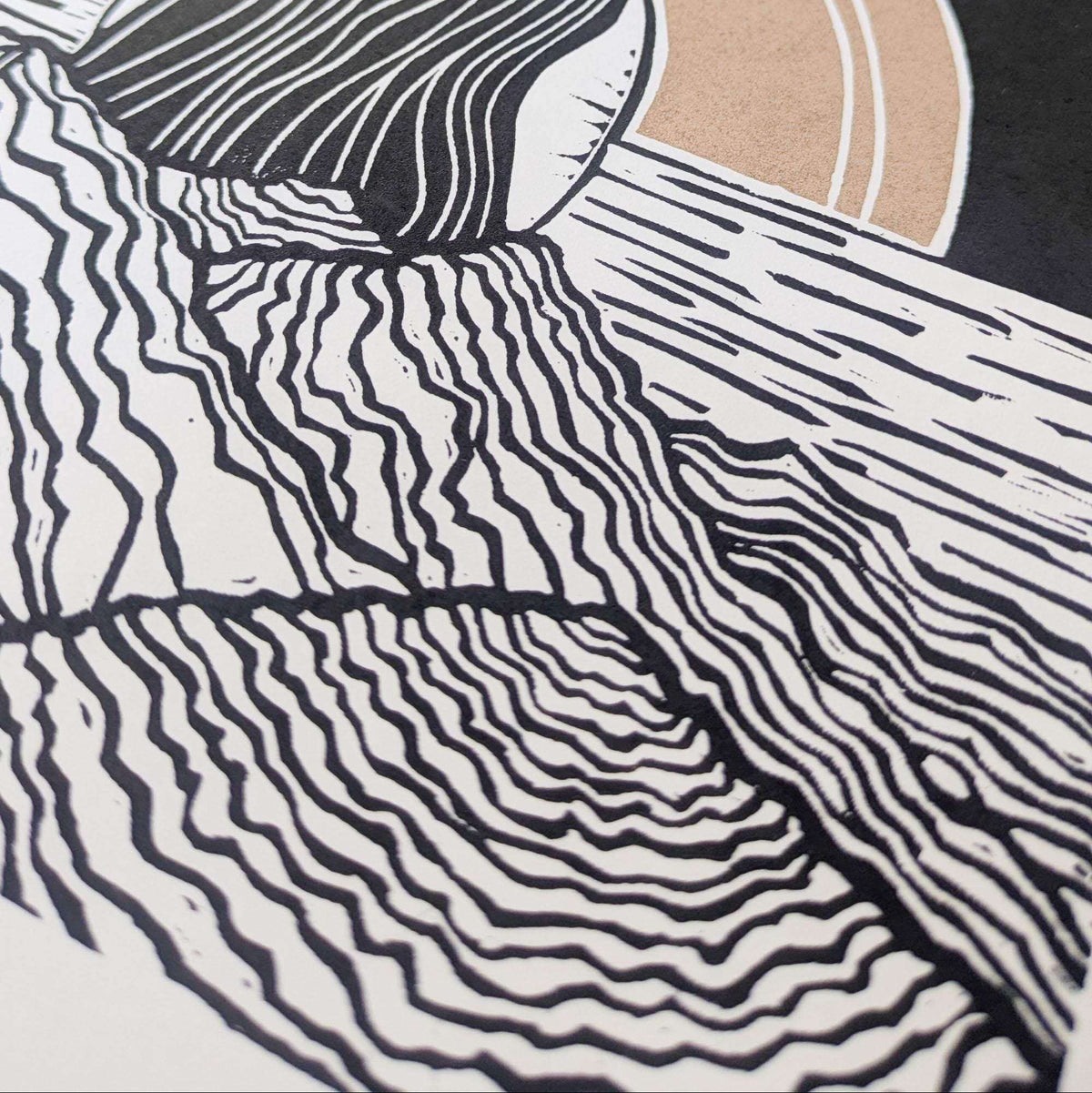 Divine Sophia Art linocut print with bold black flowing linework on cream paper and a muted peach circular detail