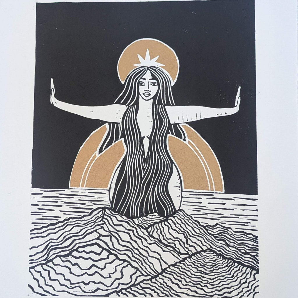 Divine Sophia Art linocut print in black, cream and ochre, depicting a long-haired goddess with outstretched arms rising from waves