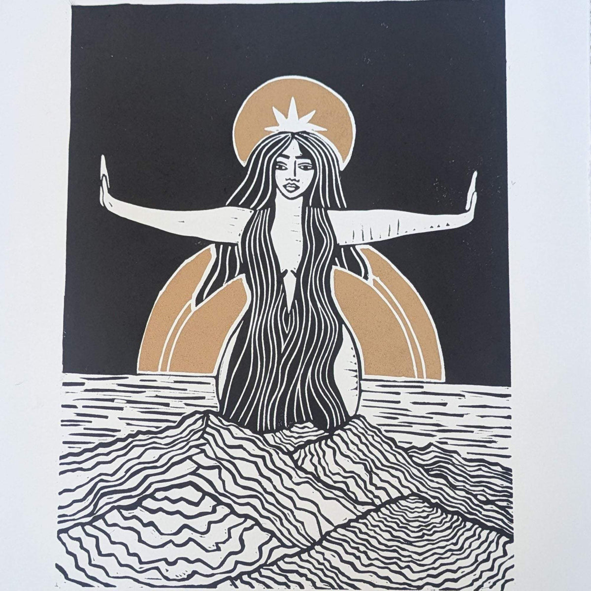 Divine Sophia Art linocut print in black, cream and ochre, depicting a long-haired goddess with outstretched arms rising from waves