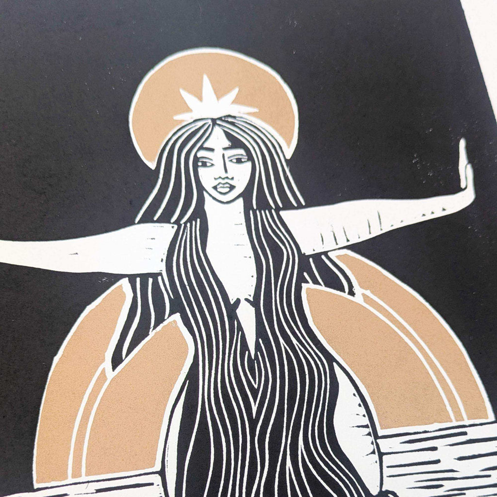 Divine Sophia Art goddess linocut print in black, ivory and warm tan, featuring flowing hair and outstretched arms