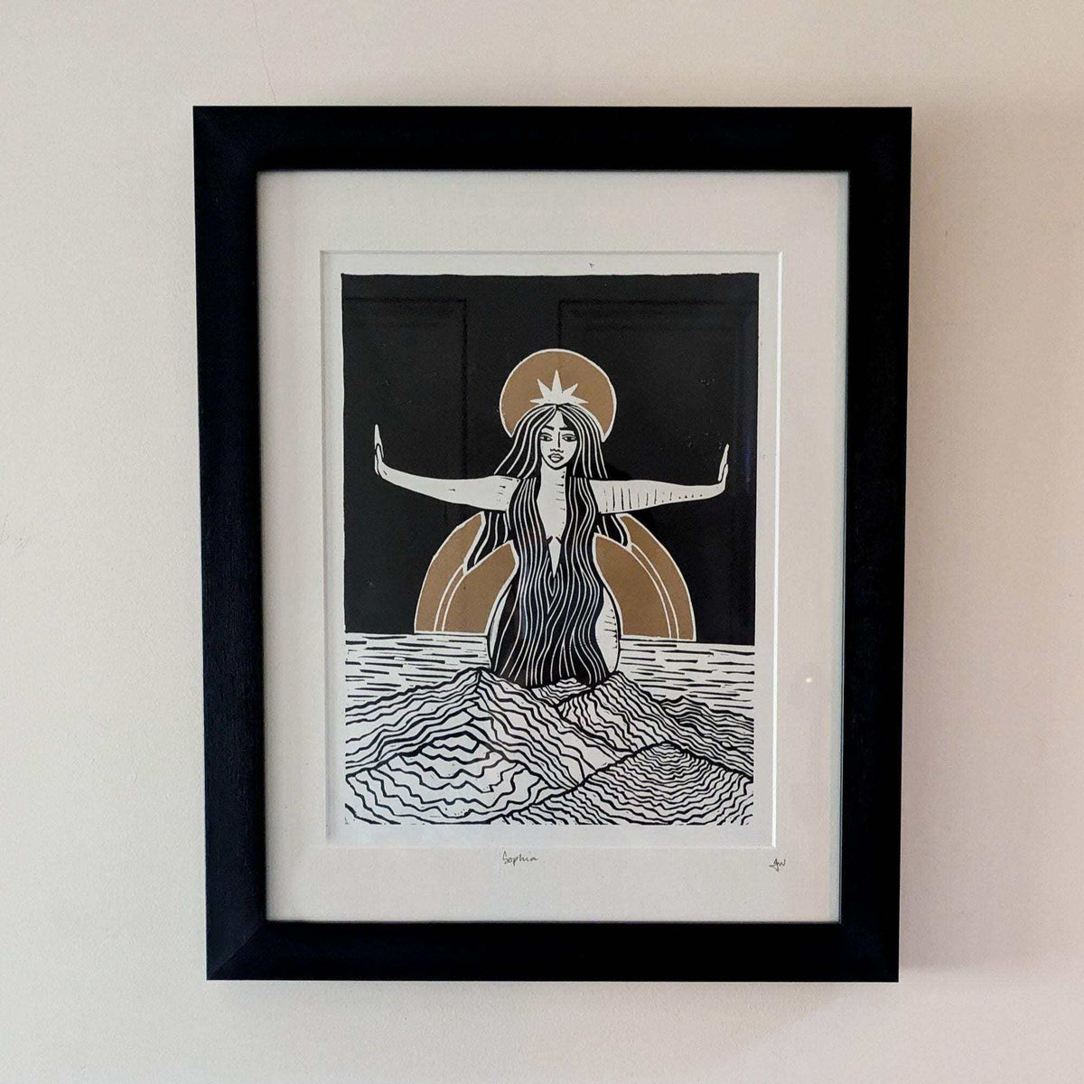 Divine Sophia Art linocut print of a long-haired goddess with outstretched arms, black, white and ochre on paper