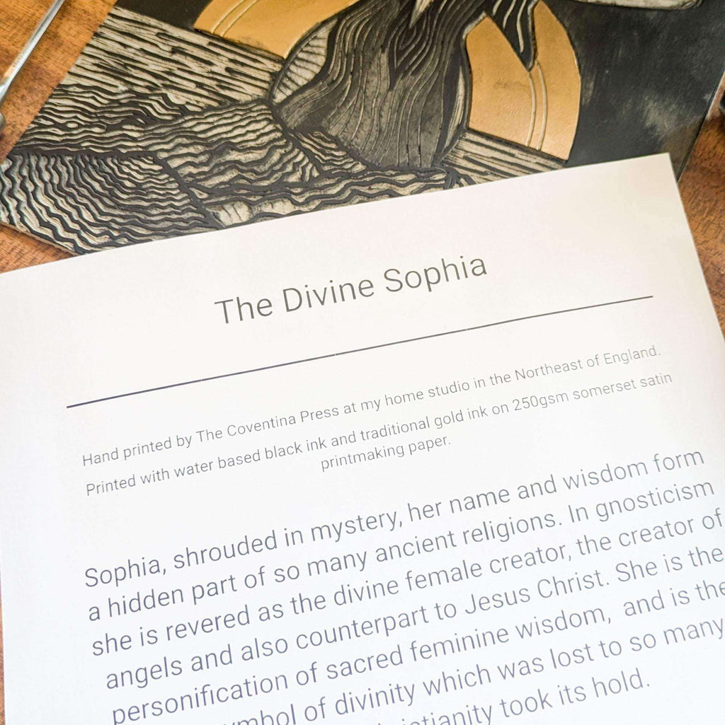 Divine Sophia Art linocut print with black carved lines, gold-toned shapes and text on white paper