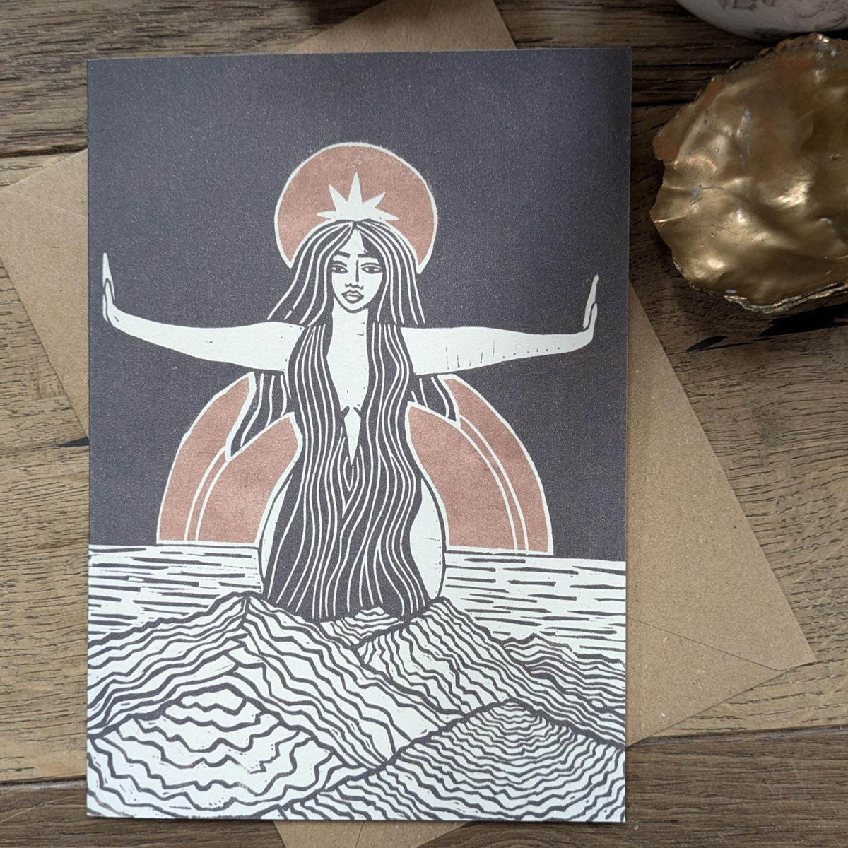 Divine Sophia Greeting card with a black-and-white linocut goddess, flowing hair, outstretched arms and muted terracotta halo