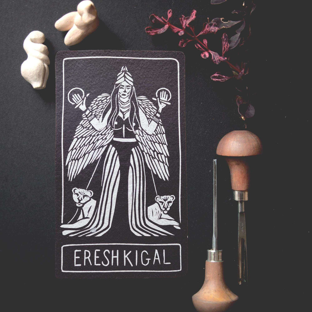 ERESHKIGAL ALTAR CARD, black cotton rag card with a white linocut goddess, feathered wings and lettering