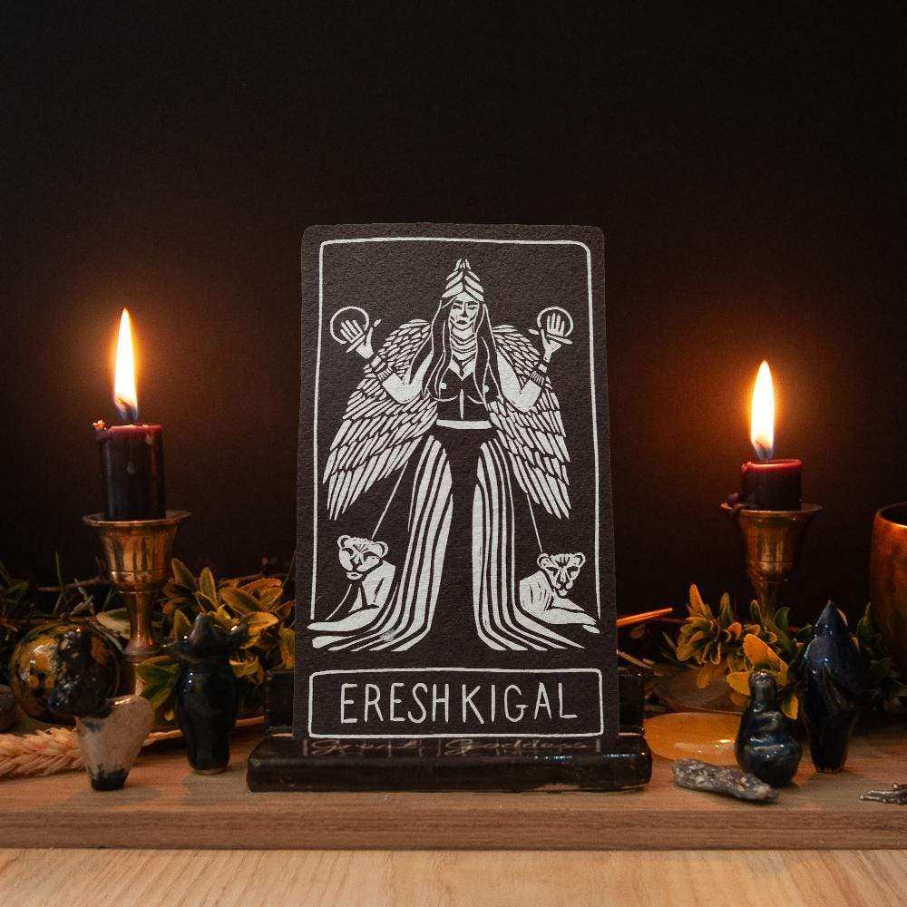 ERESHKIGAL ALTAR CARD with a white linocut-style goddess figure and lettering on a black rectangular card
