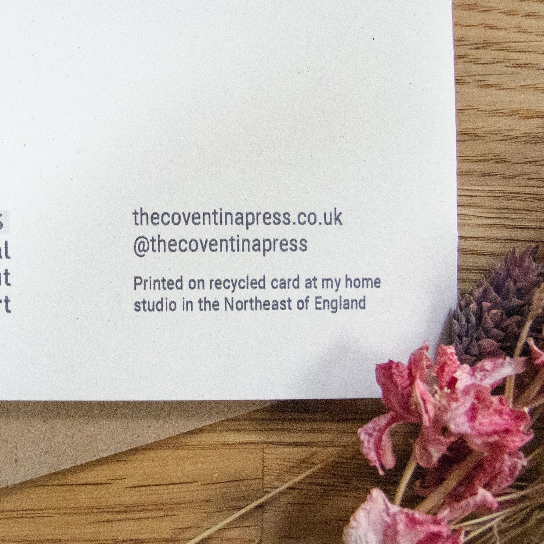 greeting card of divine sophia linocut print in black and dusky gold sun behind her