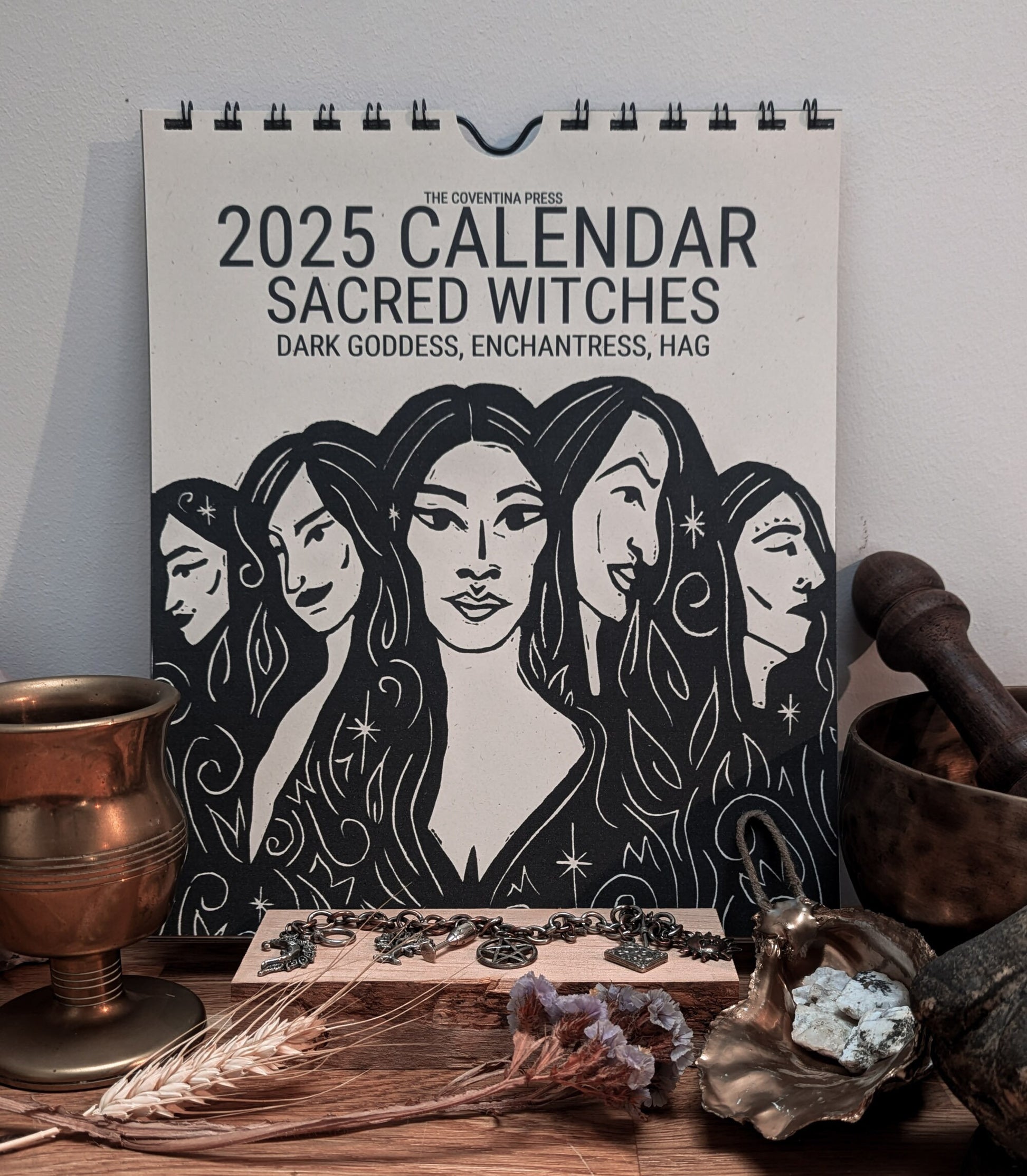 a 2025 calendar sacred witches with 5 witchy women on the front cover