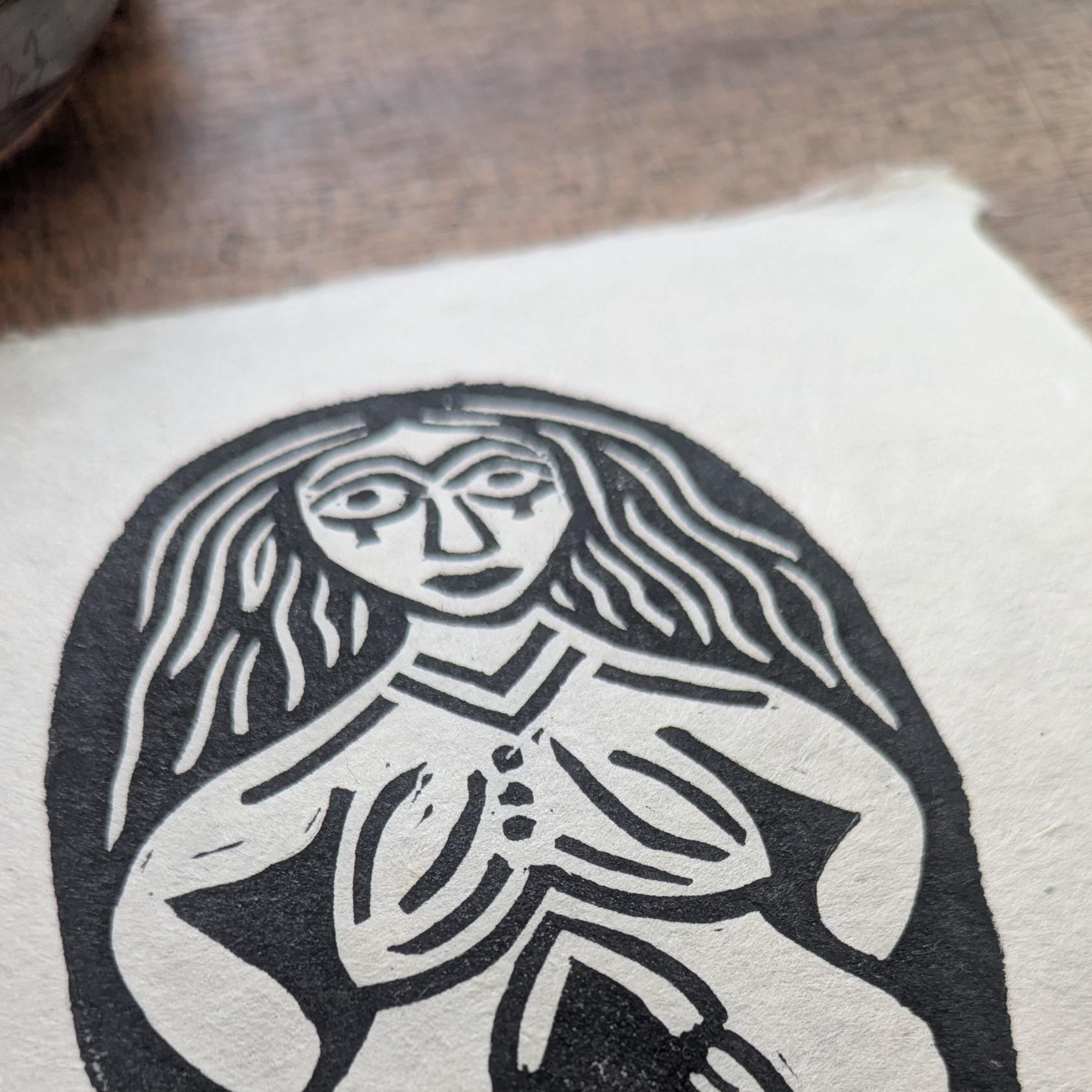 clsoe up detail of a sheela na gig print