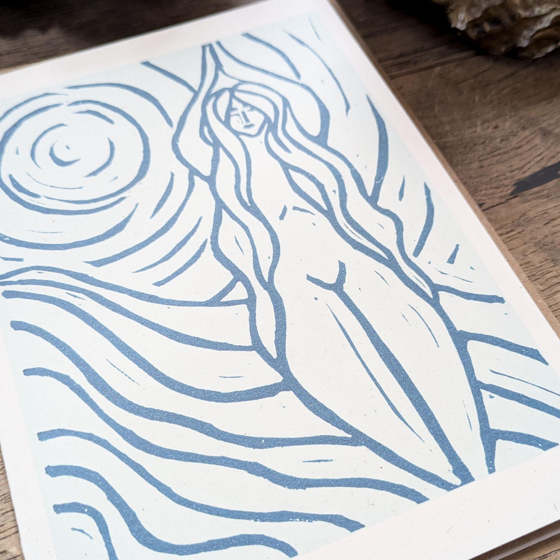 blue greeting card with naked woman the moon and water around her achelois