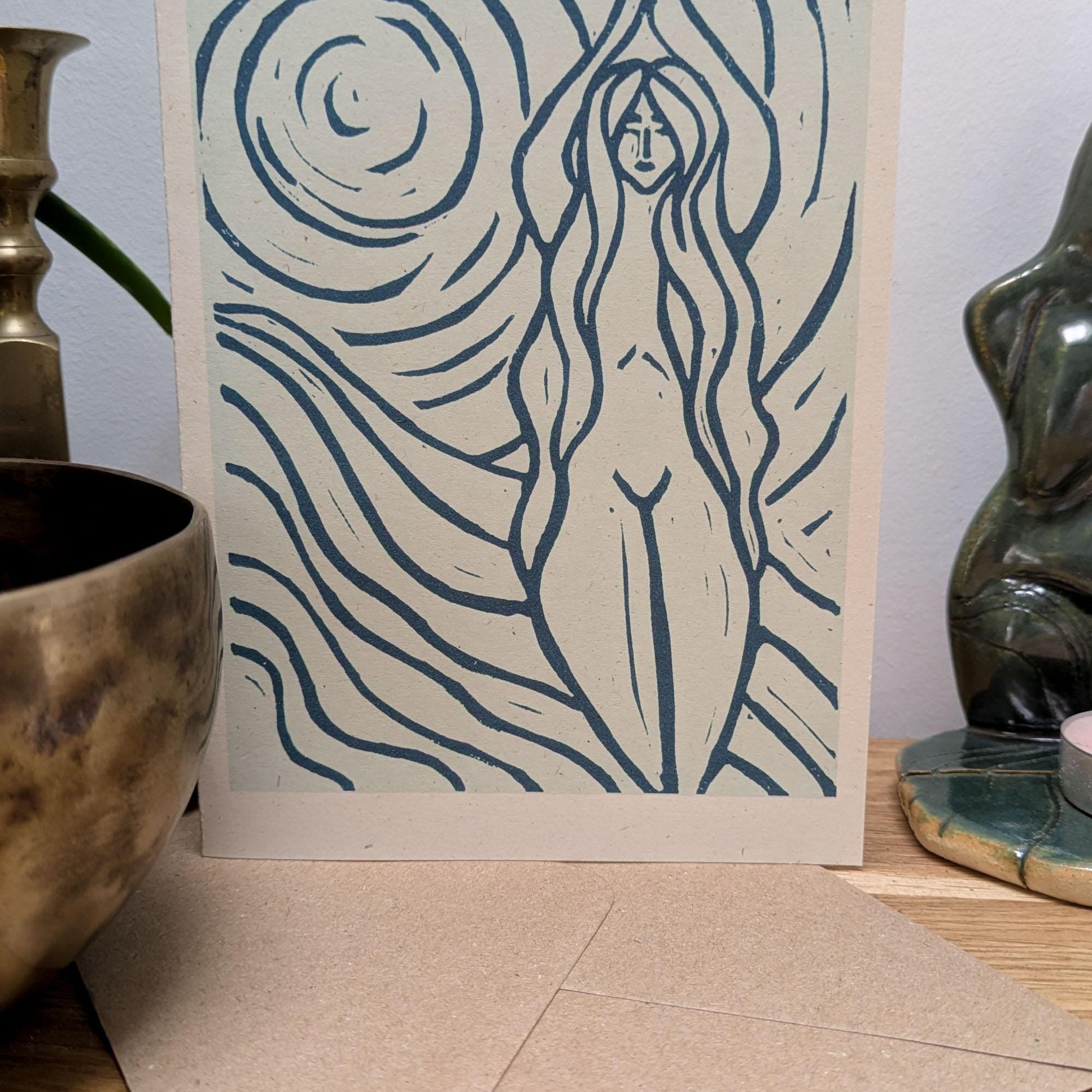 blue greeting card with naked woman the moon and water around her achelois