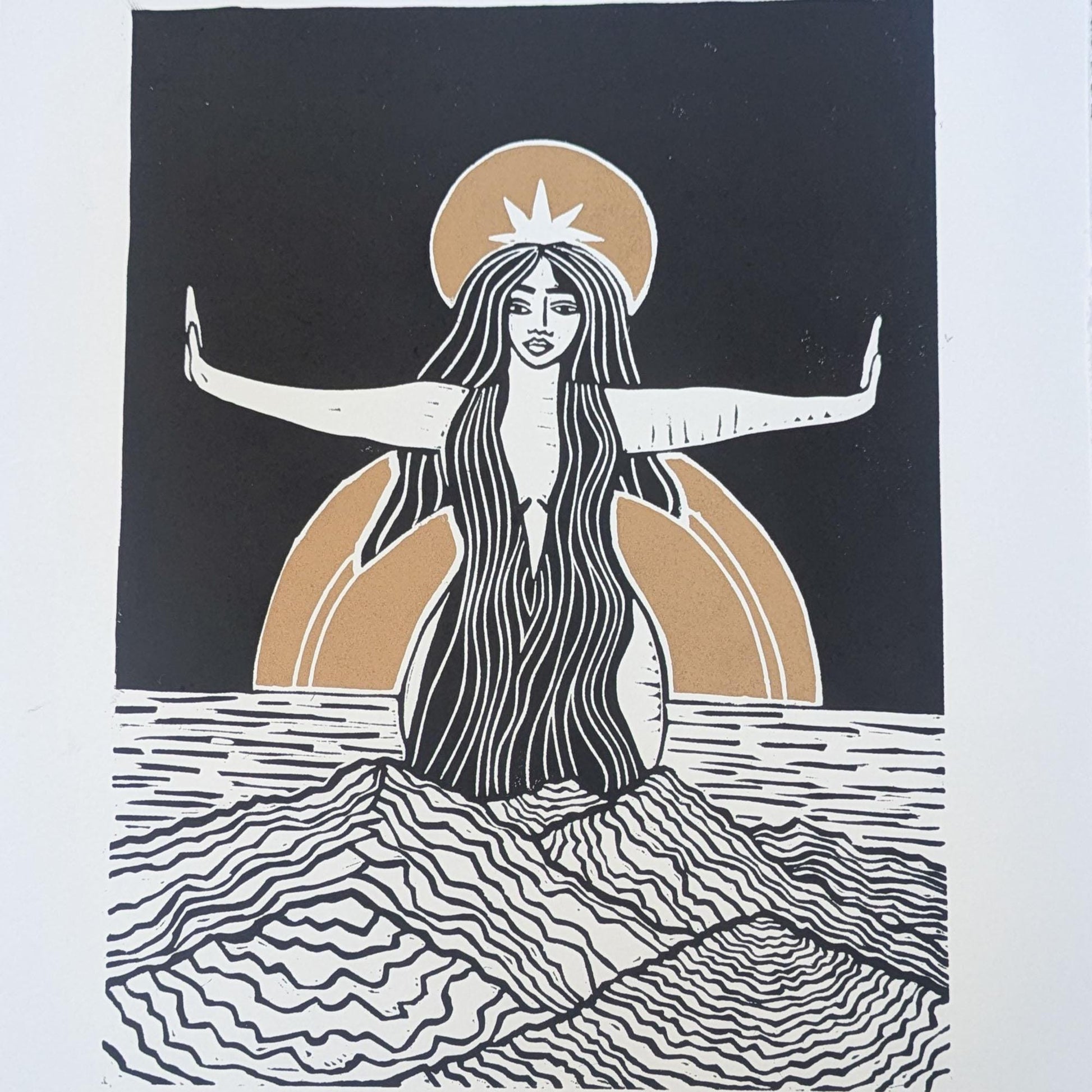 goddess sophia gold and black standing arms out in the sea