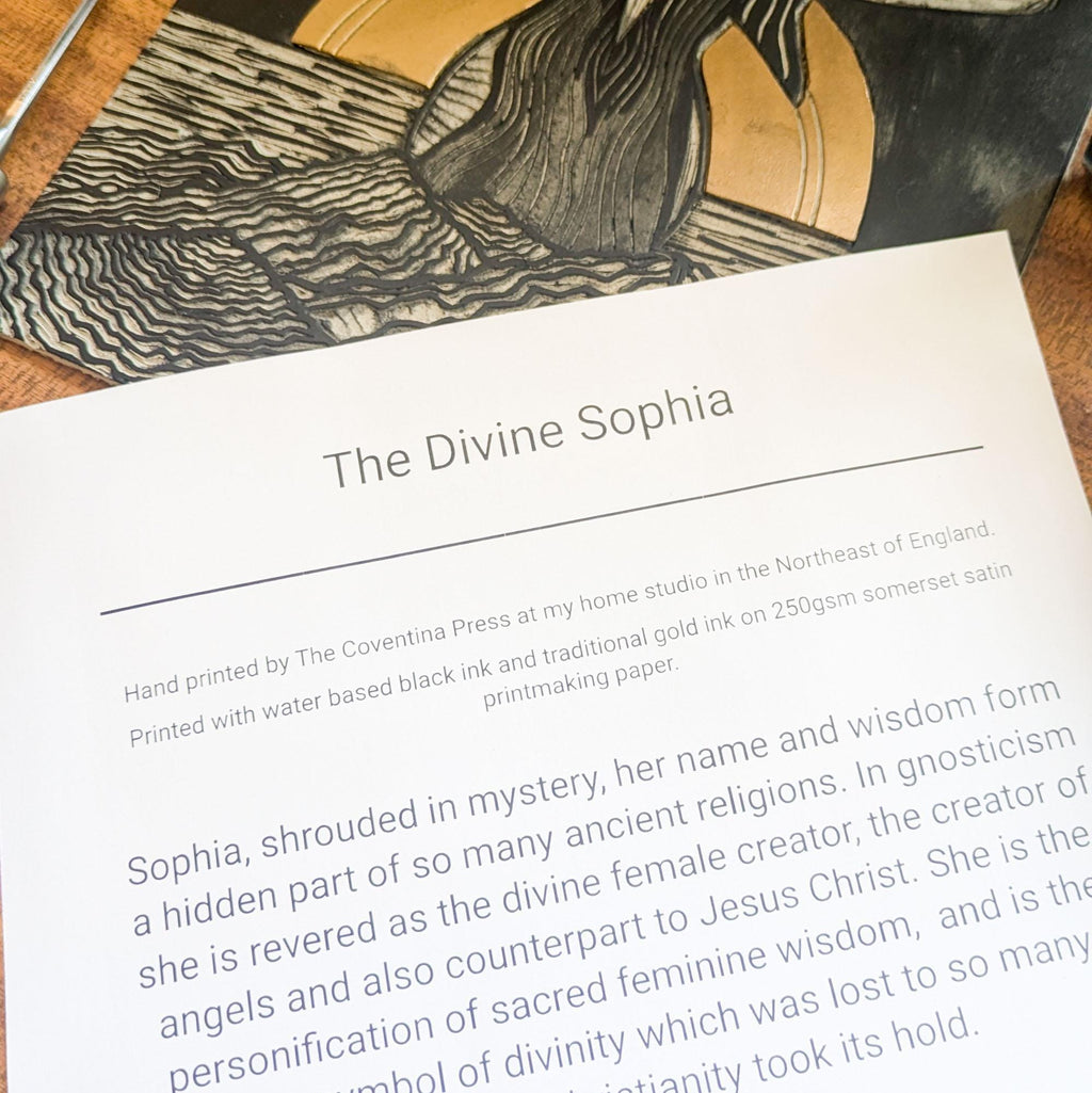 goddess sophia gold and black standing arms out in the sea