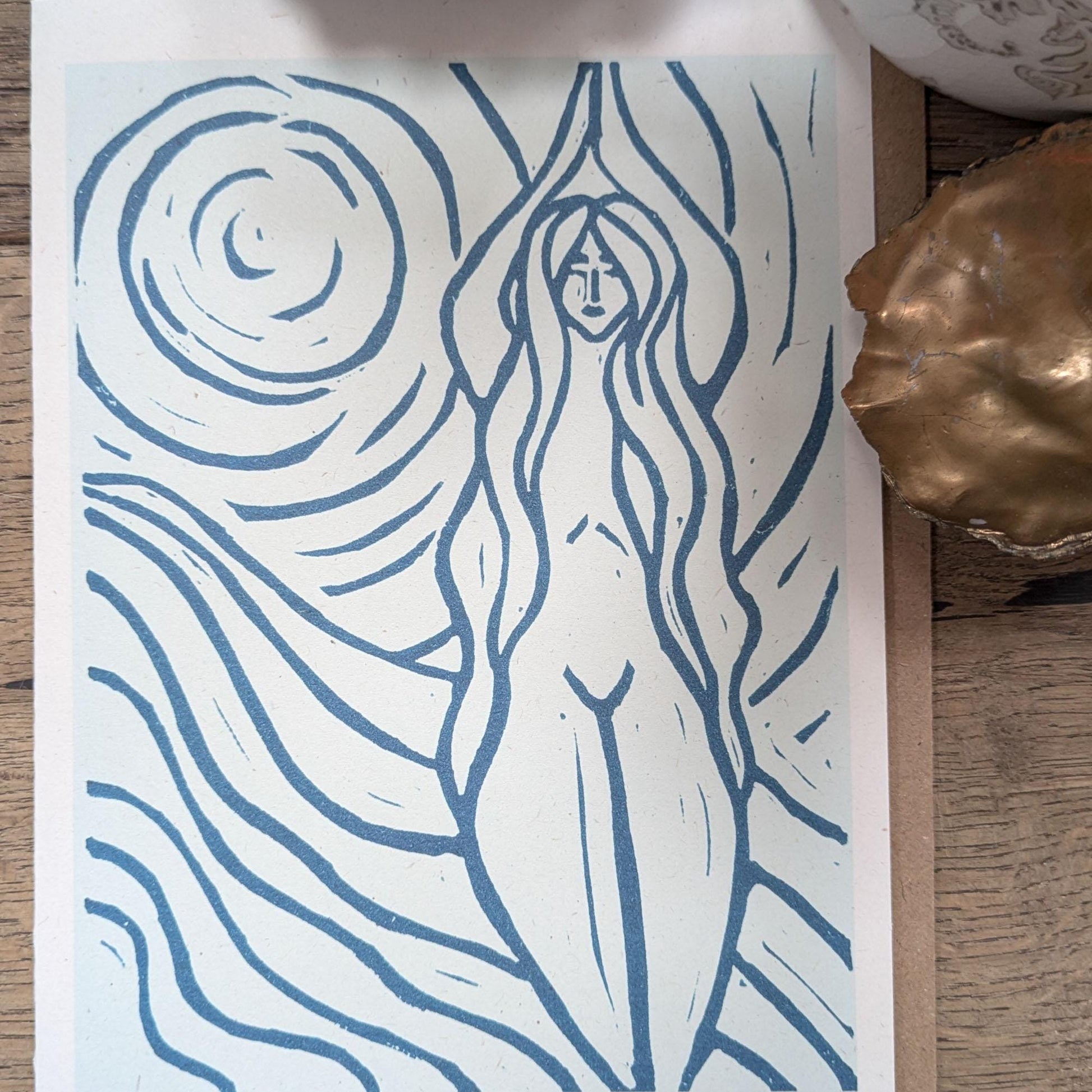 blue greeting card with naked woman the moon and water around her achelois
