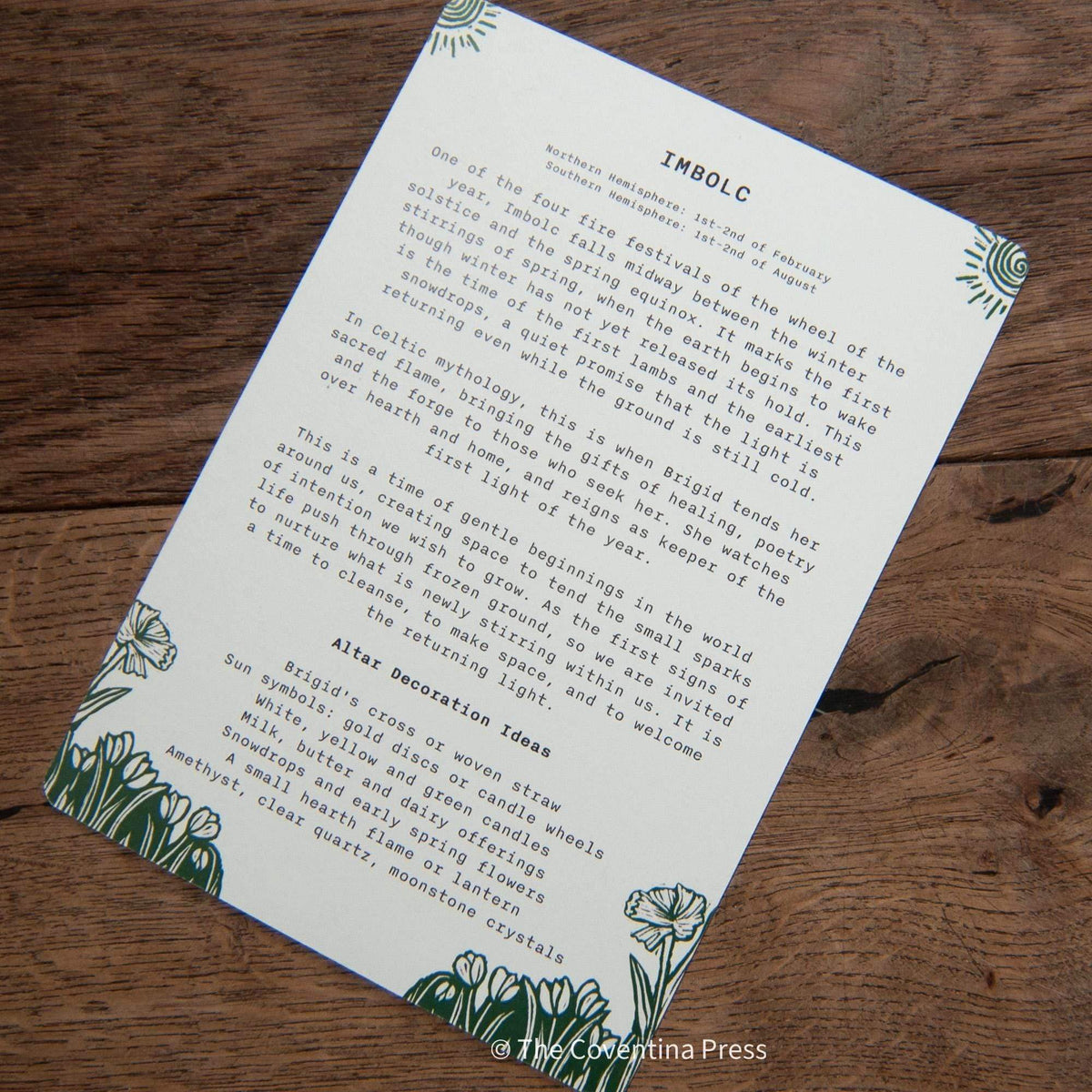 IMBOLC altar card in cream cardstock with blue-green floral linocut borders and printed festival text on the reverse