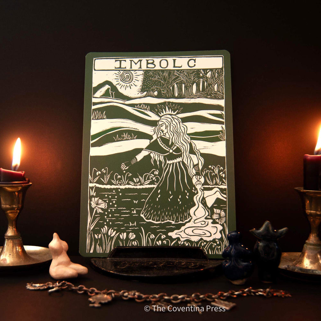 IMBOLC altar card with a cream and dark green linocut of a woman in a flowing dress amid rolling hills