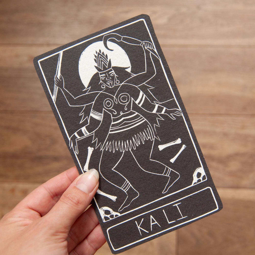 KALI ALTAR CARD in black with a white linocut-style illustration of the multi-armed goddess Kali and her name below