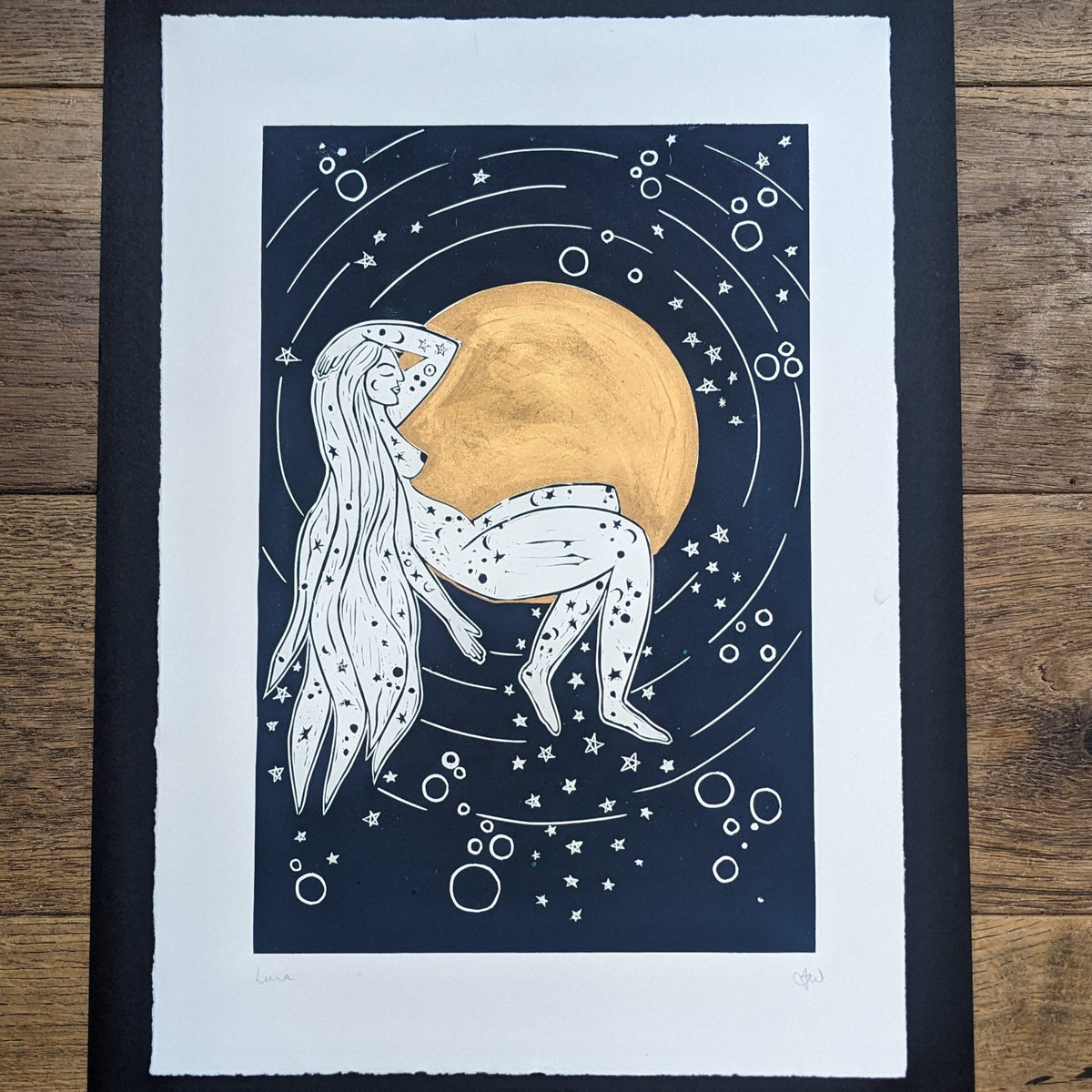 LUNA | ROMAN MOON GODDESS linocut print in navy and white, showing a reclining woman among stars with a gold moon