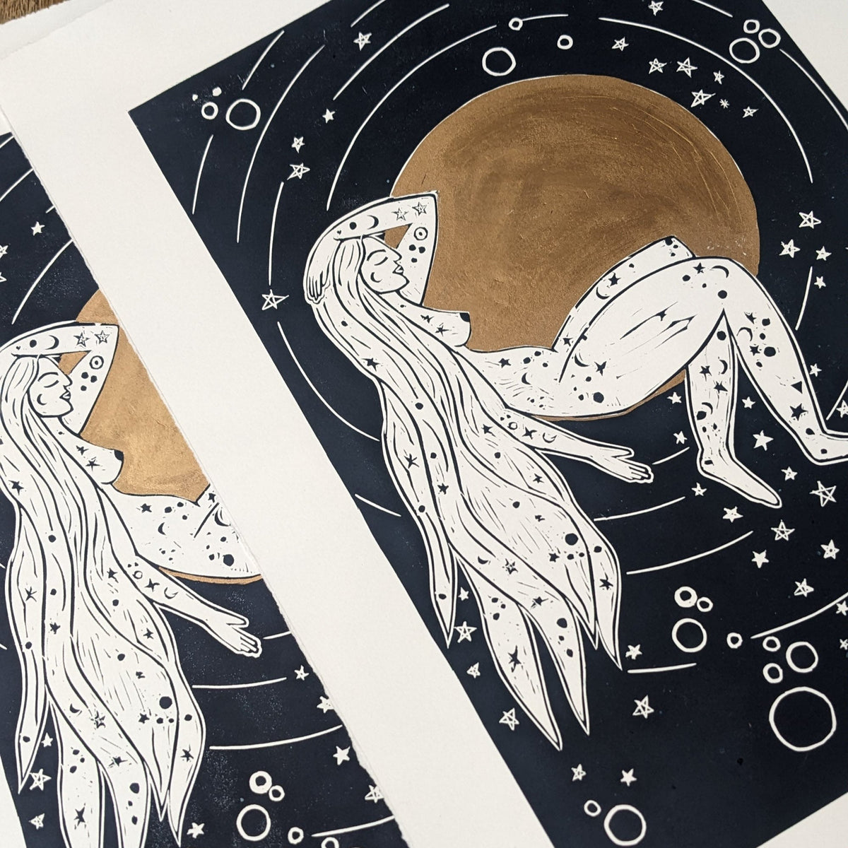 LUNA | ROMAN MOON GODDESS linocut print with a nude goddess beneath a large gold moon, surrounded by stars