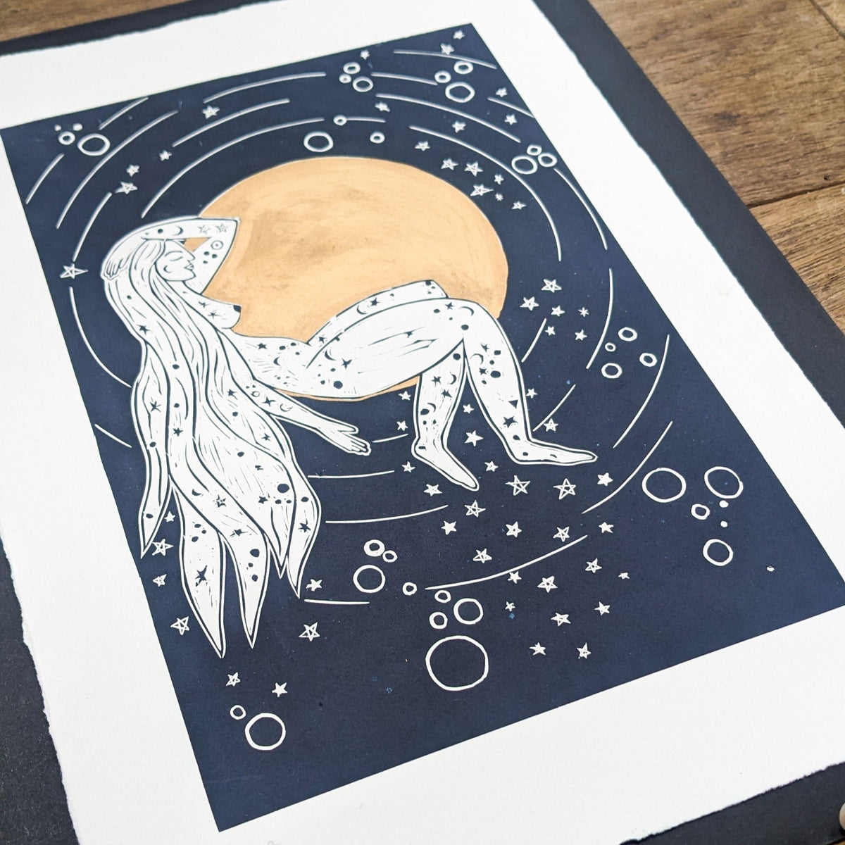 LUNA | ROMAN MOON GODDESS linocut print in navy and white, featuring a reclining goddess beneath a gold-toned moon