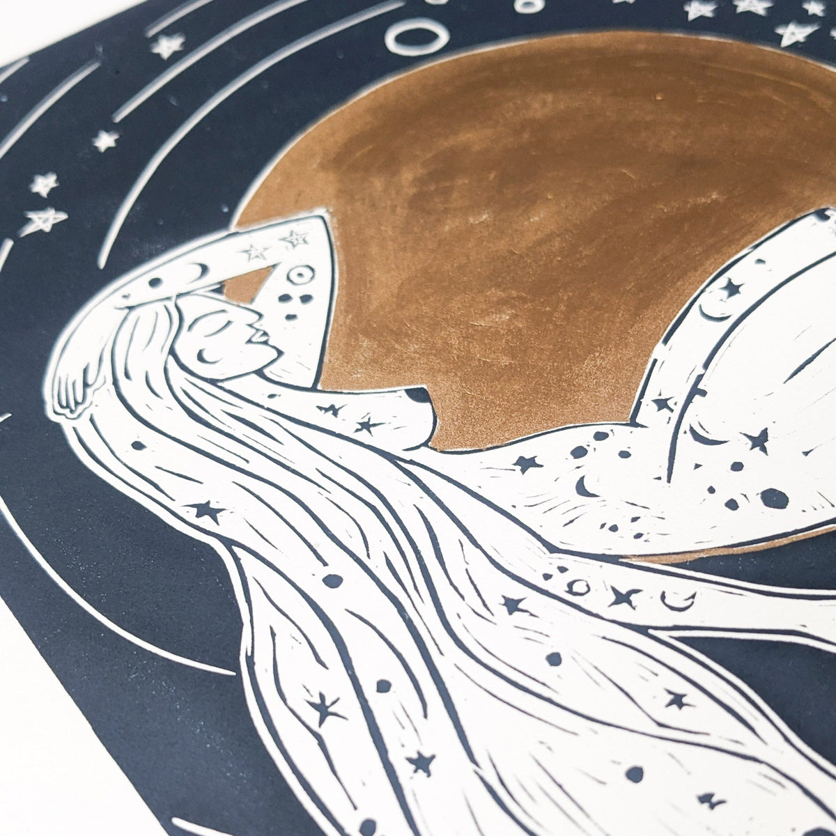 LUNA | ROMAN MOON GODDESS linocut print in navy and white, depicting a flowing-haired figure beneath a gold moon