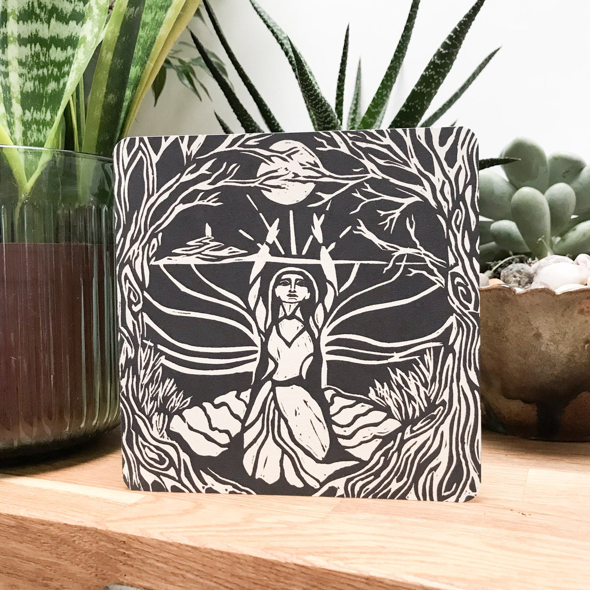 MORGANA LE FAY Greeting card with a black-and-white linocut of a robed woman beneath a tree canopy