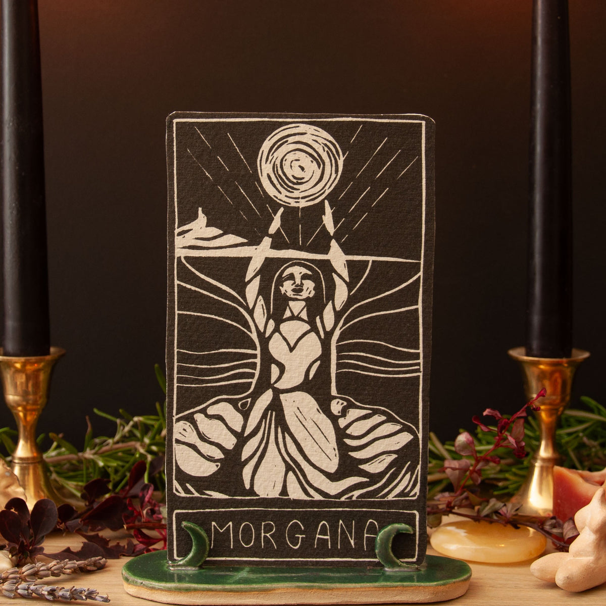 MORGANA ORACLE CARD in black with a cream linocut of a goddess raising her arms beneath a radiant sun