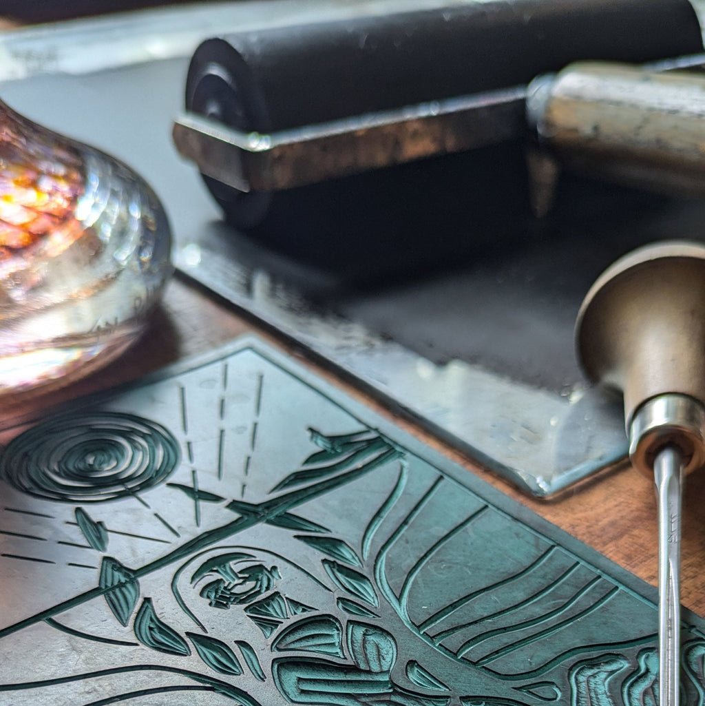 MORGANA ORACLE CARD linocut printing block with an etched goddess figure, hair, leaves and swirling lines