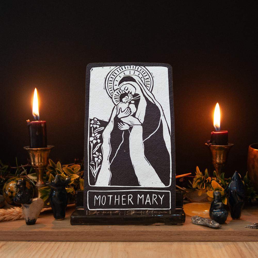 MOTHER MARY ALTAR CARD with a black-and-white linocut of Mary holding a child, haloed and framed with a name panel