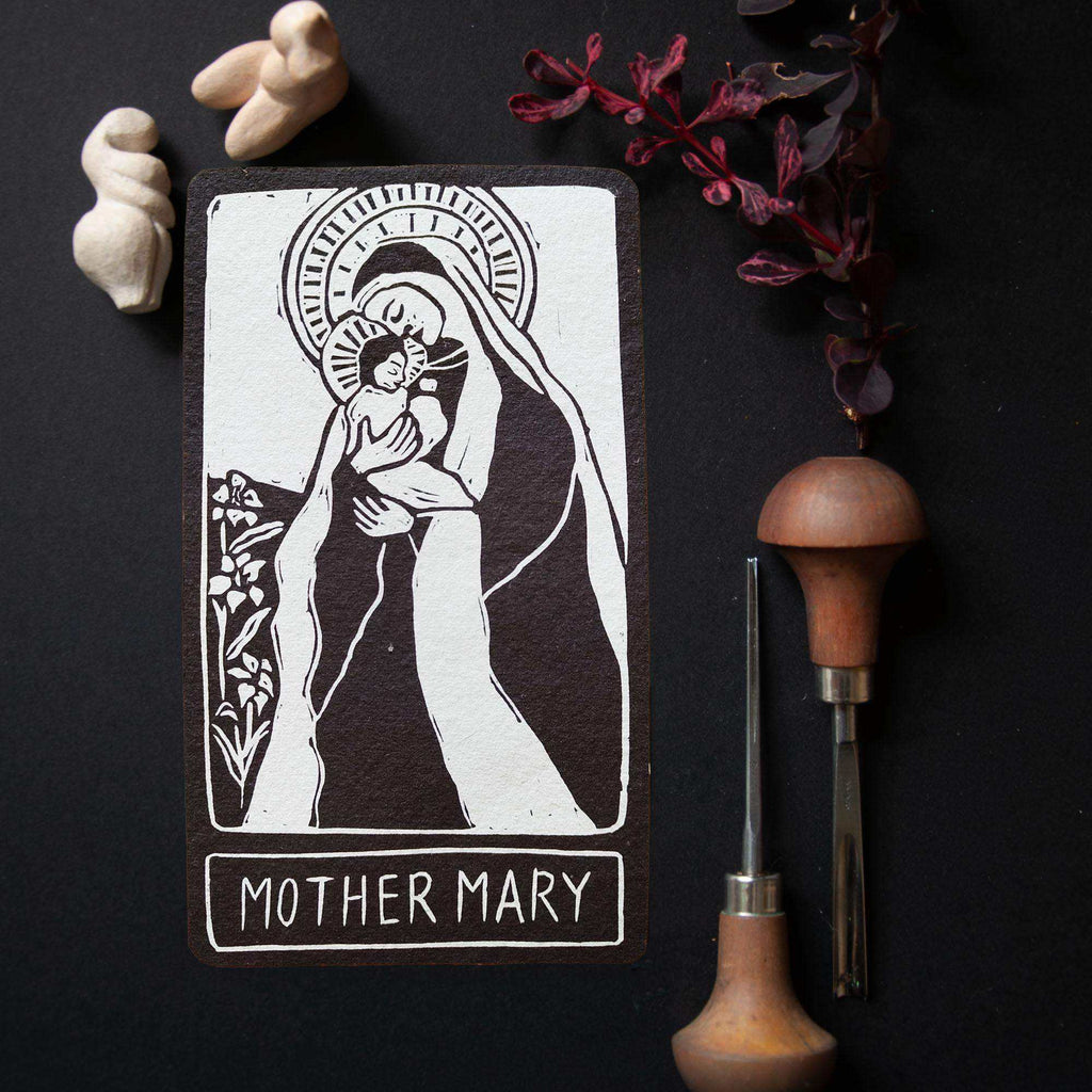 MOTHER MARY ALTAR CARD with a black-and-white linocut of Mary holding a child, framed by a halo and flowers