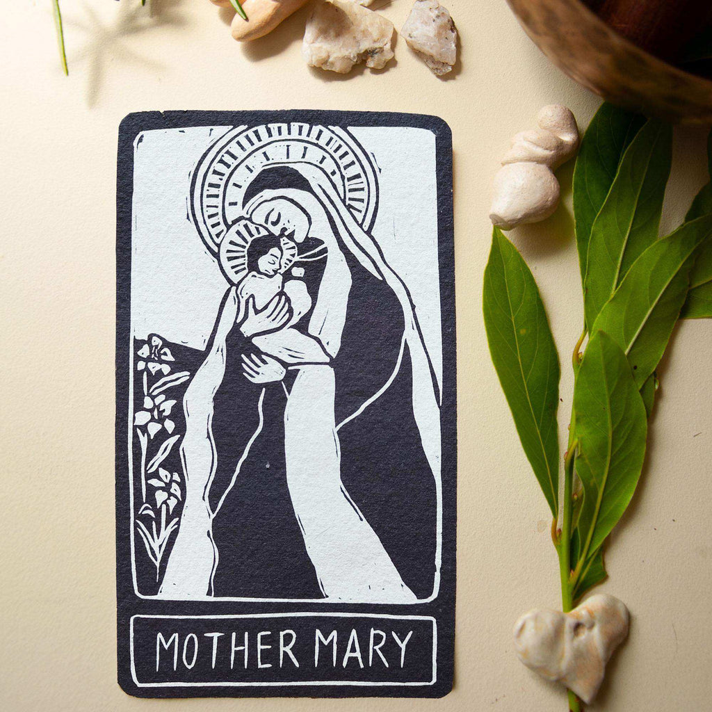 MOTHER MARY ALTAR CARD featuring a black and white linocut of Mary holding a child, with a halo and lettering