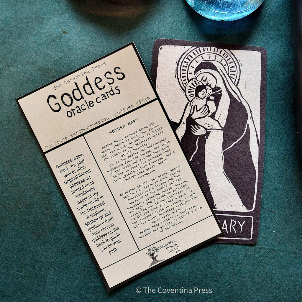 MOTHER MARY ALTAR CARD with a black-and-cream linocut of Mary holding a child, alongside its printed mythology insert.