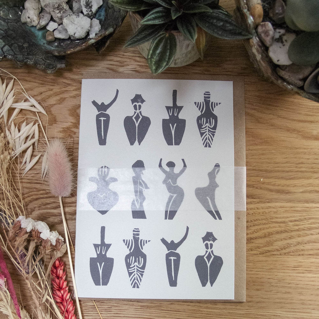 PREHISTORIC GODDESS GREETING CARD in natural cardstock, featuring a dark linocut pattern of stylized dancing figures.